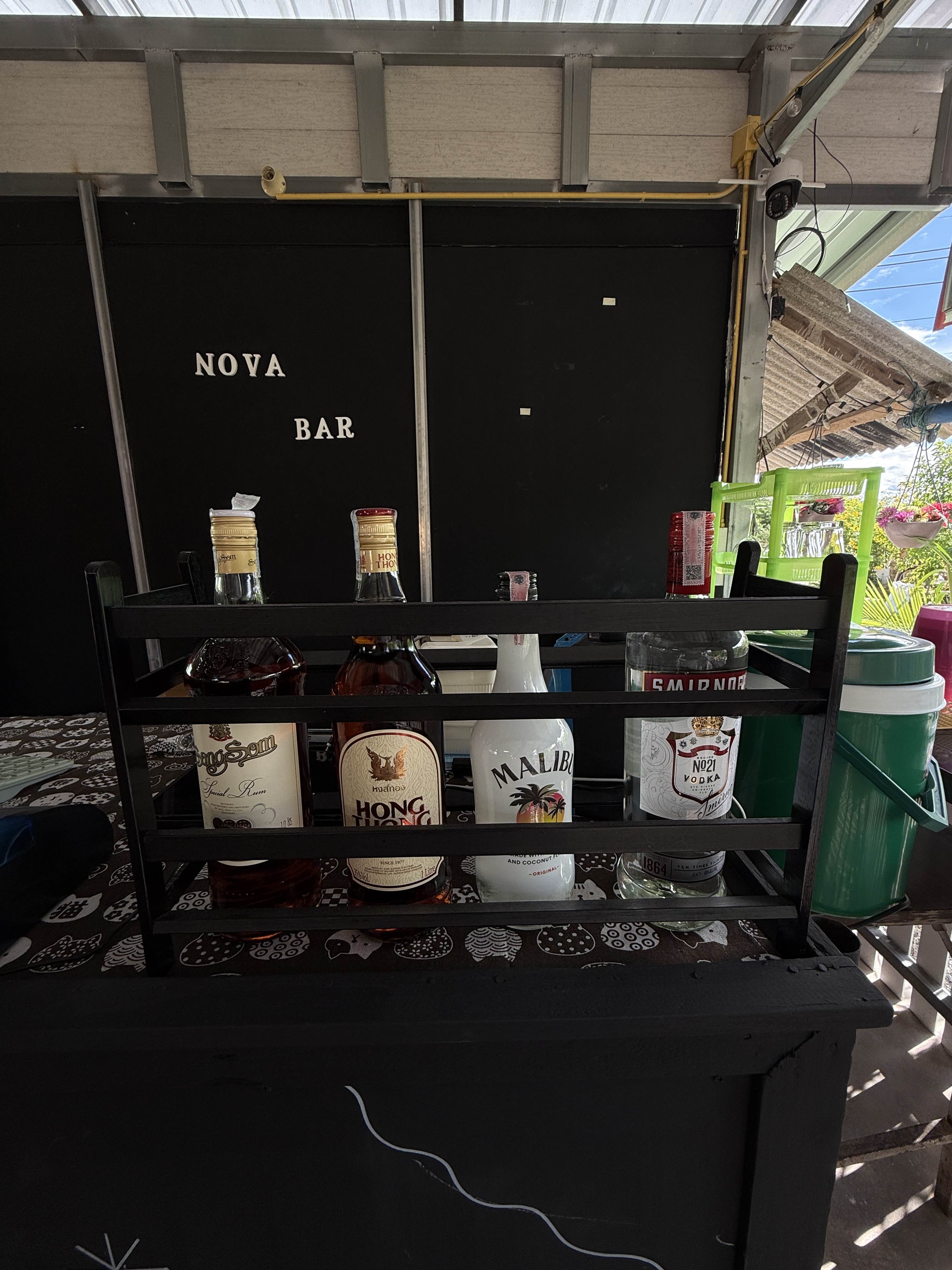 Nova Bar setup with premium spirits and cocktail ingredients